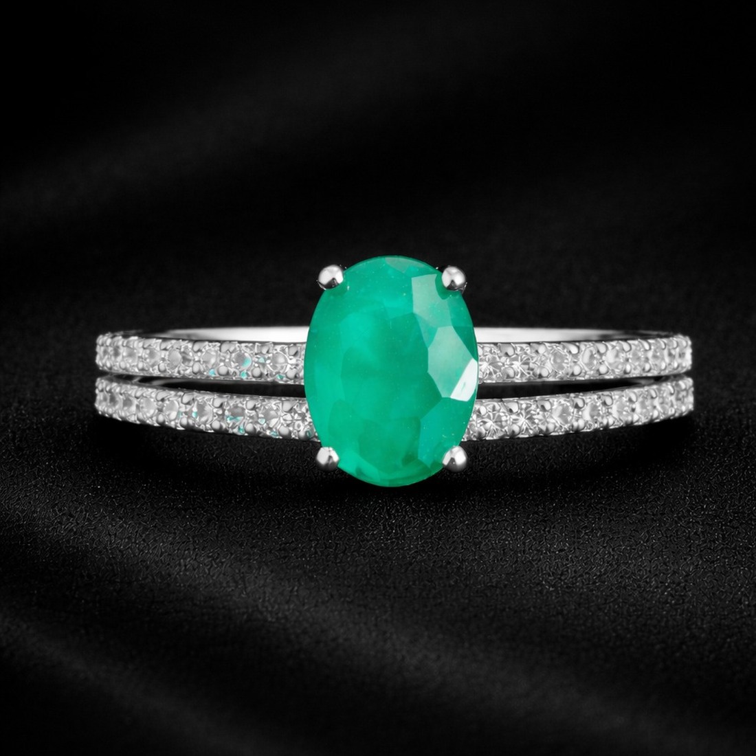 Close up of a Venaya Twin Band Emerald Spark ring